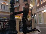 Sonya swinging on a lamp post